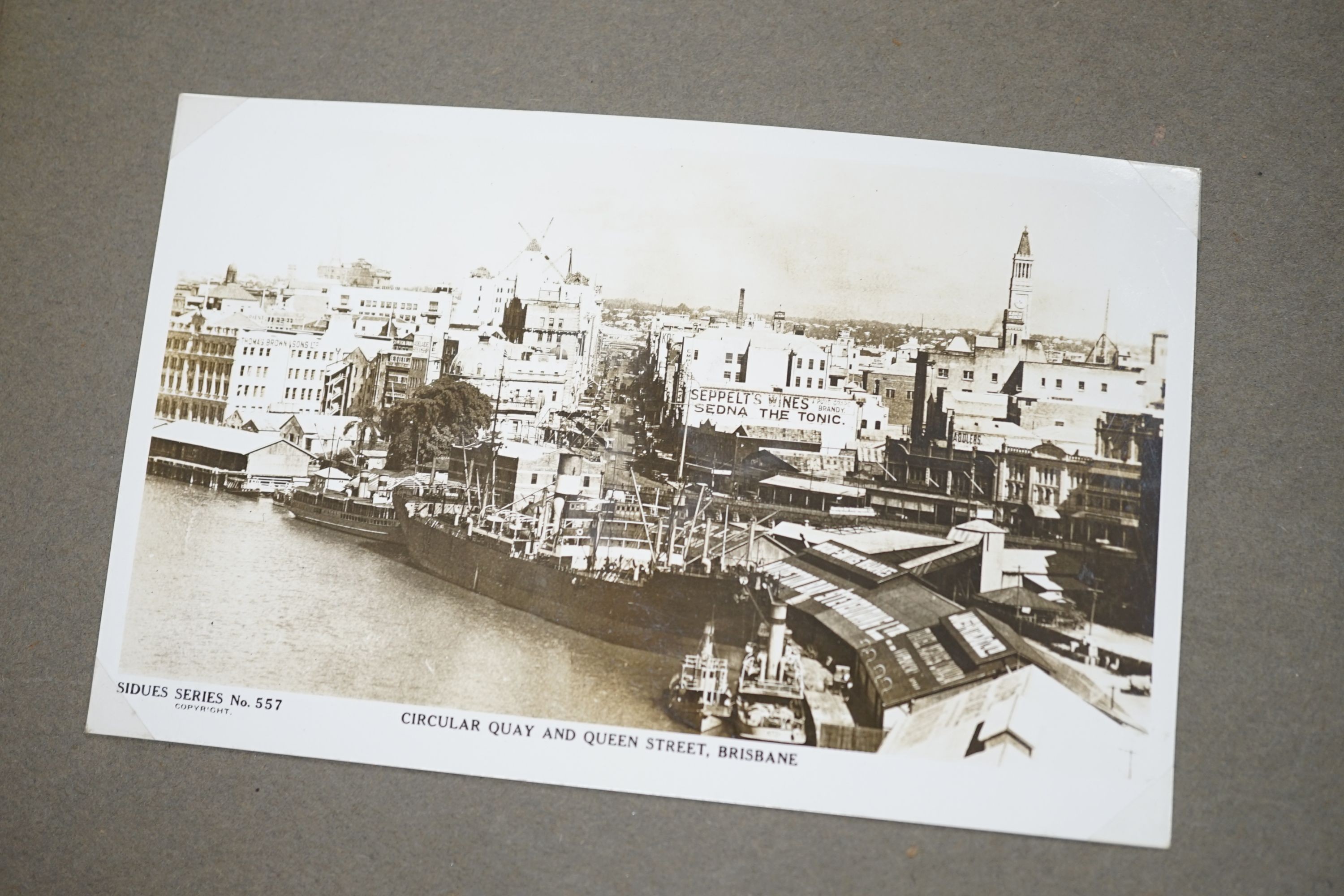 A collection of postcards, a photo album and an album of silks